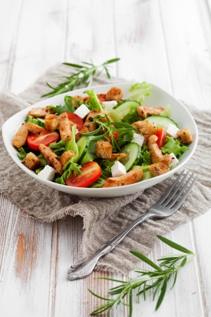 Salad with roasted chicken, tomatoes and fetaの写真素材