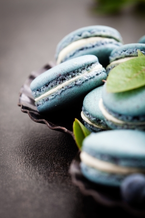 Close up of blueberry macaroons with white fillingの写真素材