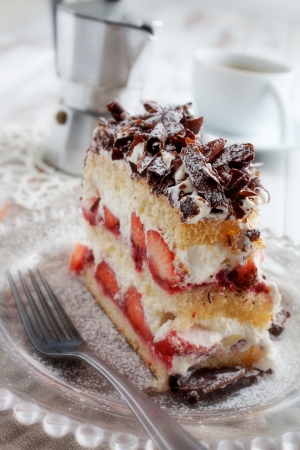 Strawberry stracciatella cake with chocolate curls on topの写真素材