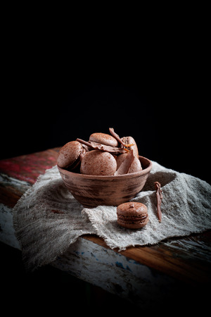Homemade double chocolate macaroons with chocolate fillingの写真素材