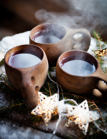Mulled wine served from kuksa, specially made wooden cupの写真素材