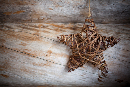 Rustic heart hanging against weathered woodの写真素材