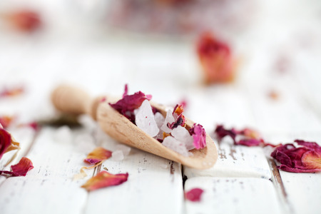 Homemade bath salt with pink rosesの写真素材