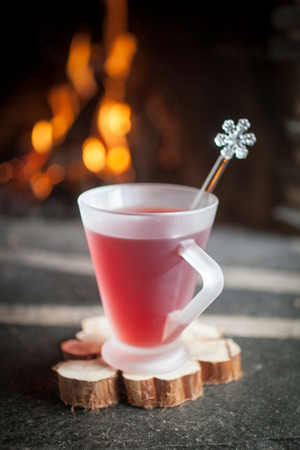 Mulled wine for one in front of fireplaceの写真素材