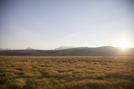 Beautiful sunset with sunrays behind the cloudsの写真素材