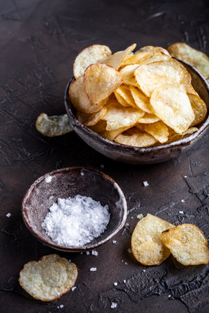 Crispy potato chips with saltの写真素材
