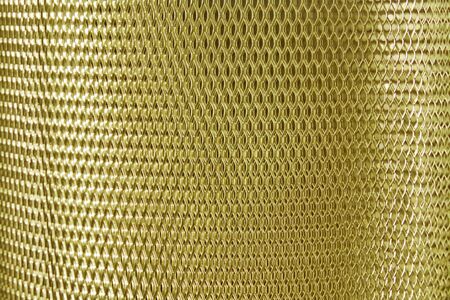 metal mesh grate gold, yellow background
の写真素材
