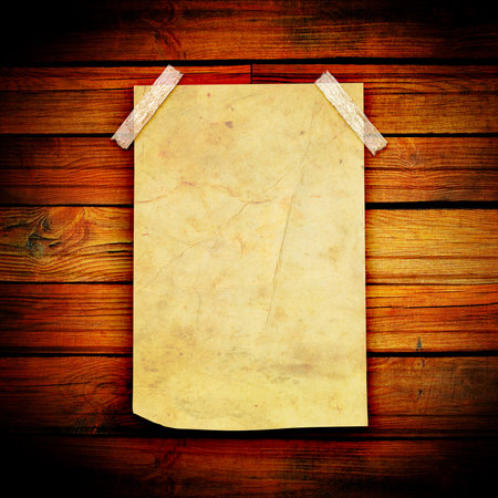 Old paper on wood wall background. Vintage paper with space for text.の写真素材