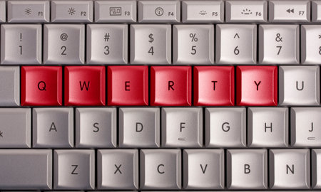 Keyboard with red keys spelling QWERTYの写真素材