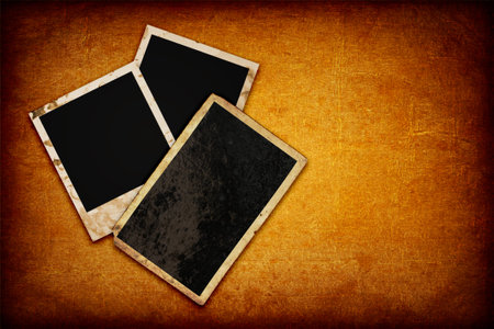Vintage photo frames on grunge paper background with space for text