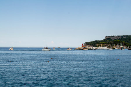 Beach, sea, mountains and sky in Kemer in Turkey. Beach Vacation July 2021の写真素材