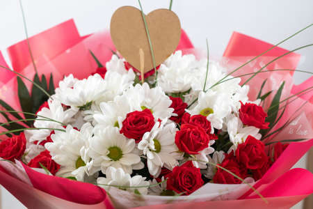 A beautiful bouquet of mixed flowers. The work of a florist in a flower shop. Bright mix of...