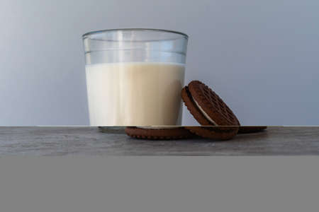 Chocolate chip cookies with milk on a light background. Chocolate sandwich - cookies.の写真素材