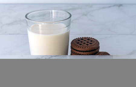 Chocolate chip cookies with milk on a light background. Chocolate sandwich - cookies.の写真素材