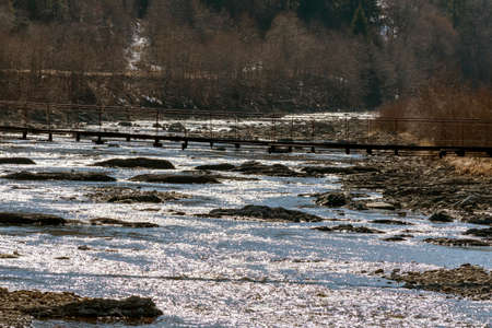 Mountain river in the mountains of Ukraine. Peremiyskaya river, Ivano-Frankivsk region. Spring 2022.の写真素材