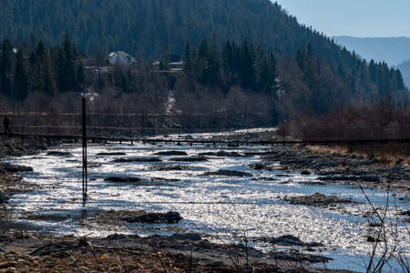 Mountain river in the mountains of Ukraine. Peremiyskaya river, Ivano-Frankivsk region. Spring 2022.
