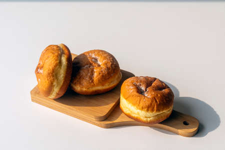 Jewish holiday Hanukkah background. A traditional dish is sweet donuts. Copy space.