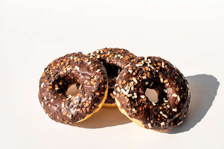 Chocolate donuts.Donuts with colorful sprinkles isolated on white background.