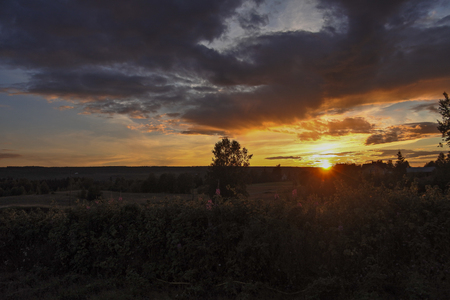Sunset over meadow in northern Swedenの写真素材