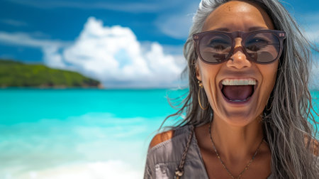 Portrait of a laughing woman on a tropical beachの素材