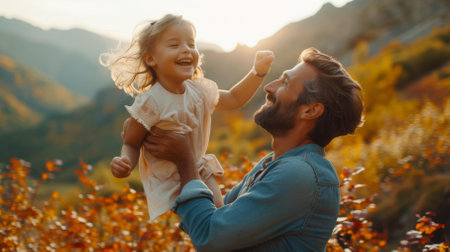 Happy father and daughter playing in the autumn forestの素材