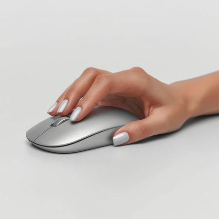 Female hand using a computer mouseの素材