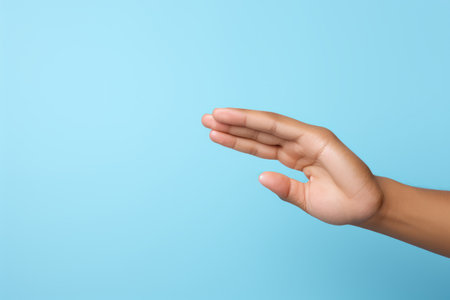 An open hand with blue backgroundの素材