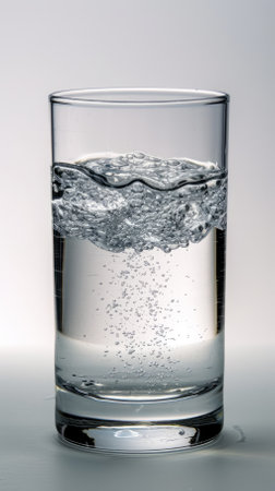 Transparent glass filled with sparkling waterの素材