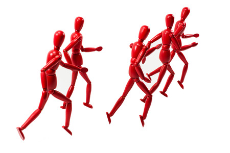 Red wooden art model group running away into the distanceの写真素材