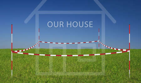 property on a meadow with blue skyの写真素材