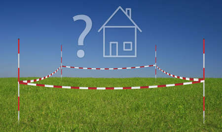 property on a meadow with blue skyの写真素材