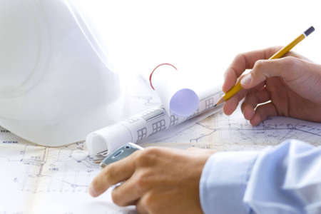young successful architect at work with his planの写真素材