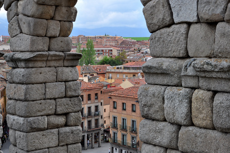 View of Segovia through the arches of the Aqueduct, Spainの写真素材