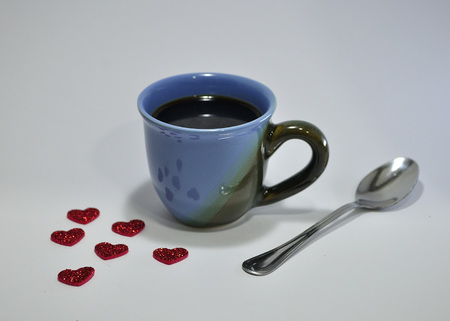 Cup of coffee decorated with hearts for Valentine's Day on white backgroundの写真素材
