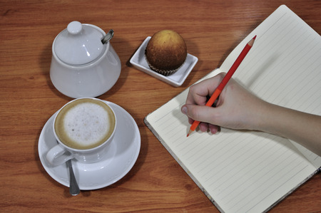 Taking notes next to a cafe