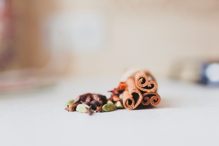 cinnamon sticks and spices on the kitchen tableの写真素材