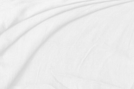 White fabric background. Abstract cloth texture with soft waves.