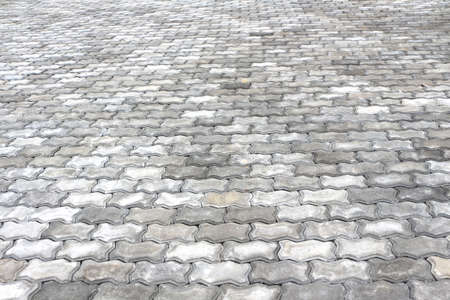 Perspective view of grey brick stone pavement.の写真素材