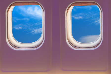 View from the plane window of the blue sky with white clouds.の写真素材