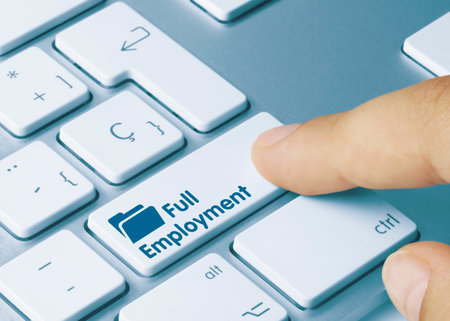 Full Employment Written on Blue Key of Metallic Keyboard. Finger pressing key.