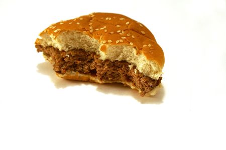Remains of a partially eaten cooked burgerの写真素材