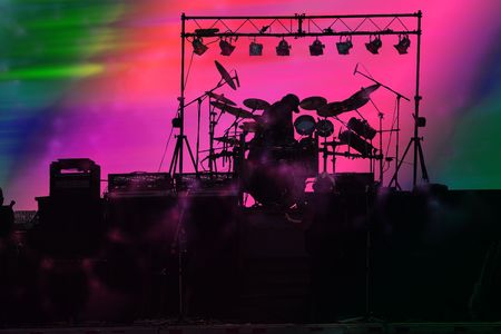 Band getting ready to start show with bright pink backgroundの写真素材