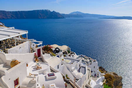 Traditional white buildings facing Aegean Sea in Oia, Santorini island, Greeceの写真素材