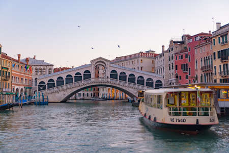 Rialto Bridge (Ponte de Rialto) across Grand Canal at sunrise / sunset time, Venice, Italyのeditorial素材