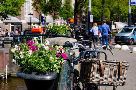 Bikes on the bridge that crosses the canal in Amsterdam, Netherlandsのeditorial素材