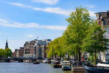 Buildings and boats along the canal in Amsterdam, Netherlandsのeditorial素材