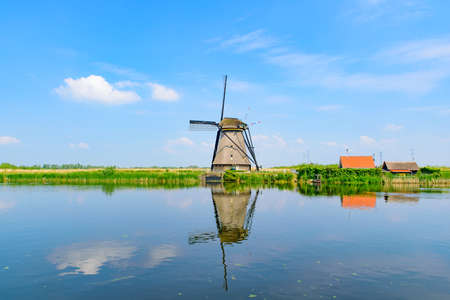 The windmills and the reflection on water in Kinderdijk, a UNESCO World Heritage site in Rotterdam, Netherlandsのeditorial素材
