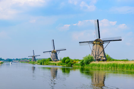 The windmills and the reflection on water in Kinderdijk, a UNESCO World Heritage site in Rotterdam, Netherlandsのeditorial素材