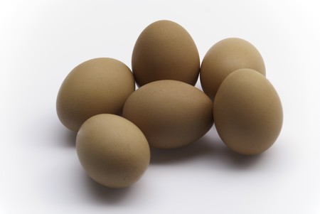 Six eggs on white backgroundの写真素材