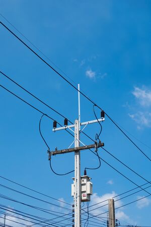 electricity posts,in to the sky,chaotic wire with nest on pole and blue sky background ,USA.の写真素材